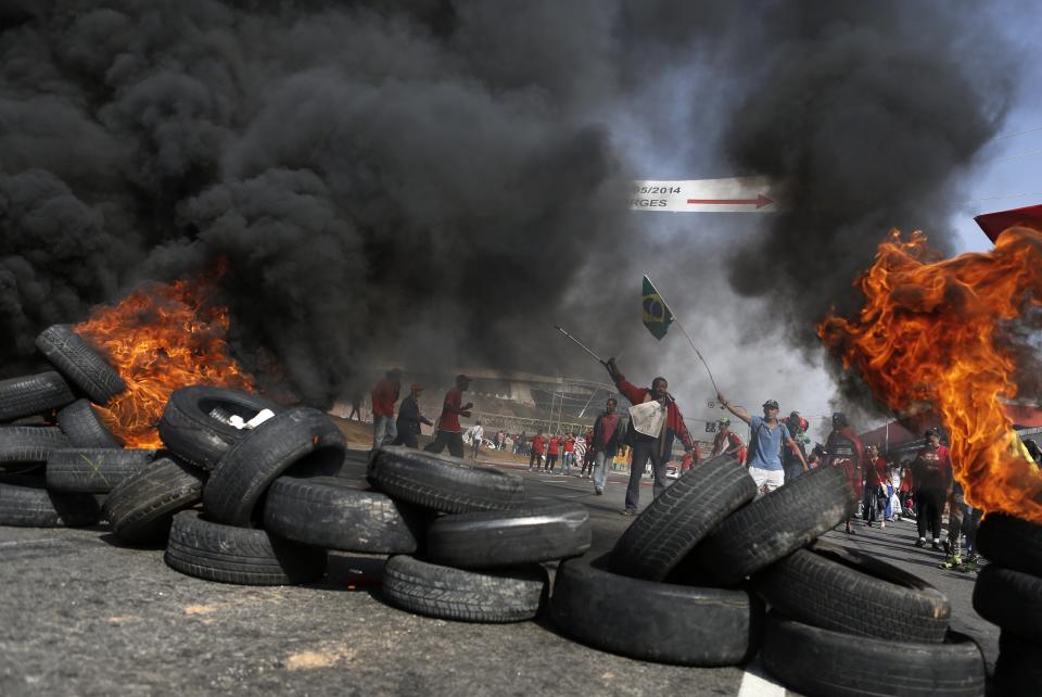 Members of Brazil's Homeless Workers' Movement block a road during a protest against the 2014 World Cup in Sao Paulo