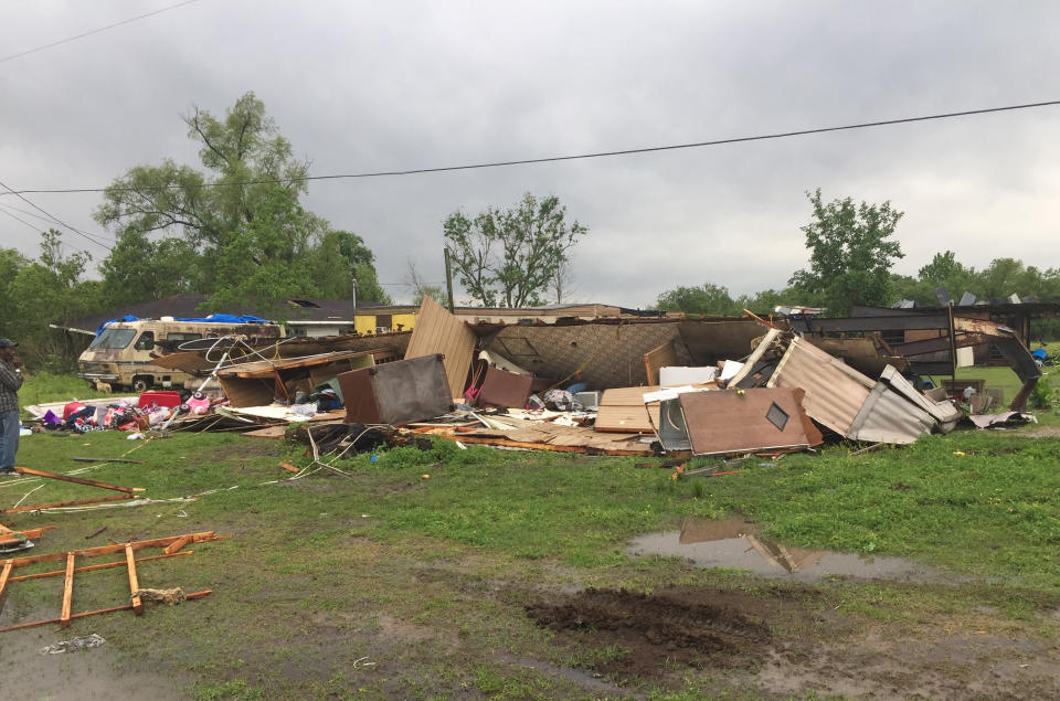 In this photo provided by the St. Martin Parish Sheriff's Office, the remains of a trailer lie where a woman and her 3-year-old daughter were killed during a severe storm, in Breaux Bridge, La., Sunday, April 2, 2017. A tornado flipped the mobile home Sunday in Louisiana, killing the mother and her daughter as a storm system with hurricane-force winds crawled across the Deep South, damaging homes and businesses. (Maj. Ginny Higgins/St. Martin Parish Sheriff's Office via AP)