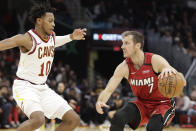 Miami Heat's Goran Dragic (7) drives past Cleveland Cavaliers' Darius Garland (10) in the second half of an NBA basketball game, Monday, Feb. 24, 2020, in Cleveland. (AP Photo/Tony Dejak)