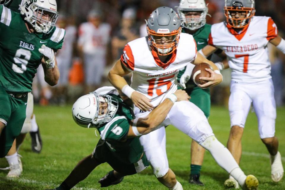 Braden Mott hangs on for a tackle of Kane Cooks. Templeton lead for most of the game but at the end Atascadero came up with the win 20-16 Oct. 6, 2023.