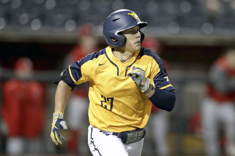 FILE - West Virginia's JJ Wetherholt runs to first against Youngstown St. during an NCAA college baseball game Thursday, March 24, 2022, in Morgantown, W. Va. The Big 12 player of the year led the nation with a .449 batting average, and he led the Mountaineers with 16 home runs, 60 RBIs, 67 runs, 24 doubles and 36 stolen bases.(AP Photo/Gregory Payan, File)