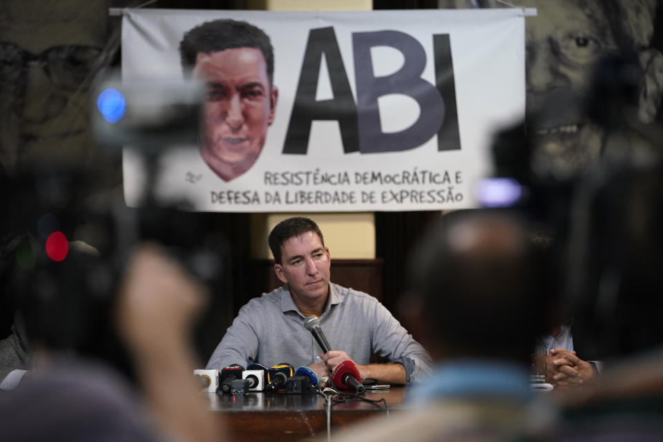 Journalist Glenn Greenwald attends a press conference before the start of a protest in his support in front of the headquarters of the Brazilian Press Association, known as ABI, in the city of Rio de Janeiro, Brazil, Tuesday, July 30 , 2019. Brazil's president has raised the possibility of jail for journalist Glenn Greenwald a few days after members of his party said the American's Brazil-based internet publication was "aligned with criminal hackers" for reporting on hacked phone calls. (AP Photo/Ricardo Borges)