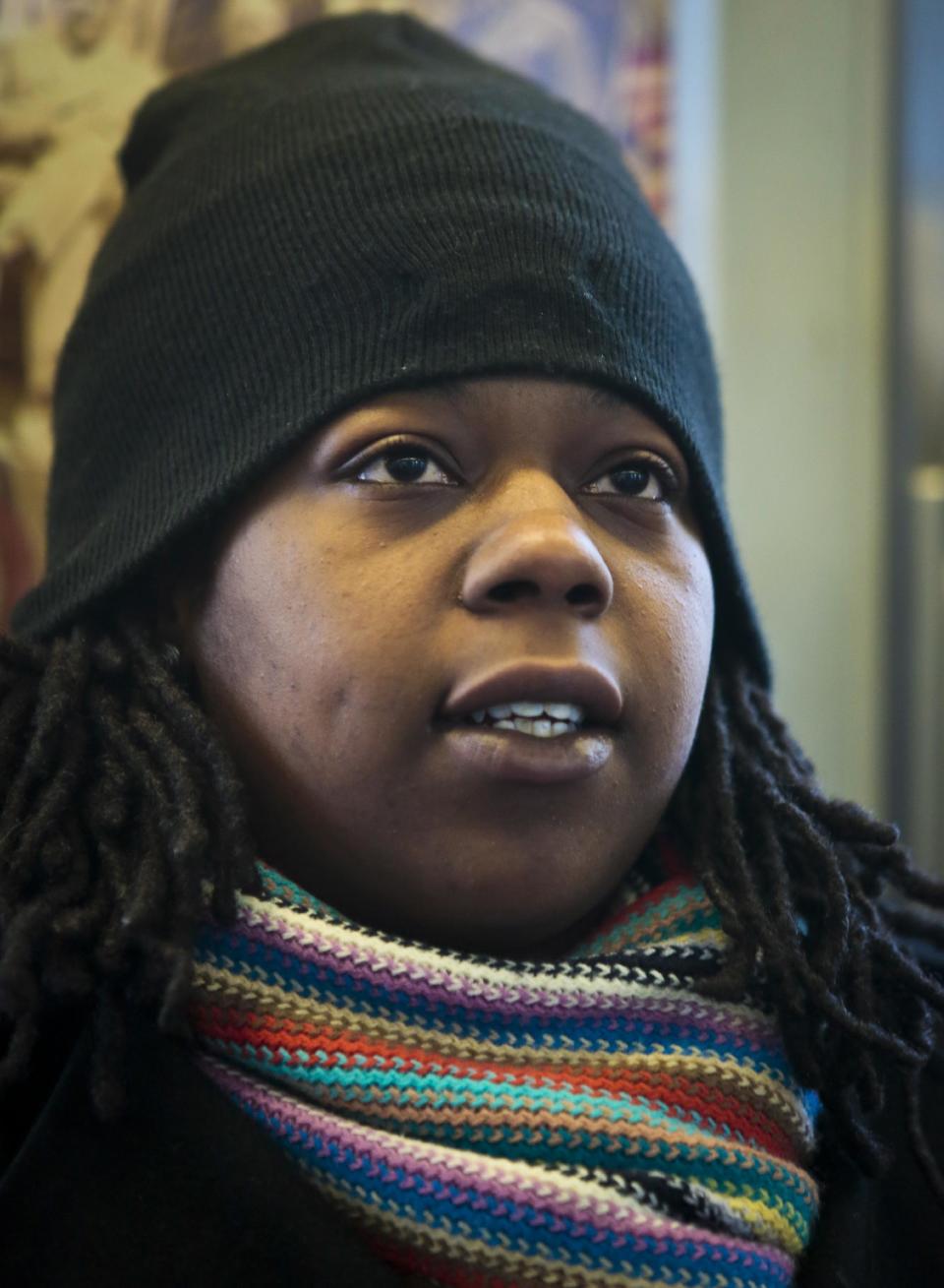 Naquasia LeGrand sits on a subway, leaving her home in the Carnarsie section of Brooklyn to her KFC job in Manhattan, on Thursday Feb. 27, 2014 in New York. A few months ago, LeGrand was just another worker on the line at KFC, boxing up chicken and cole slaw in hopes of earning enough to live in one of the nation's most expensive cities. But since being recruited by union organizers, the 22-year-old from south Brooklyn has become one of the most visible faces of a national movement demanding $15-an-hour wages for fast-food workers. (AP Photo/Bebeto Matthews)