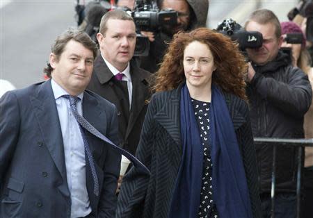 Former News International chief executive Rebekah Brooks and her husband Charlie Brooks (L) arrive at the Old Bailey courthouse in London February 19, 2014. REUTERS/Neil Hall