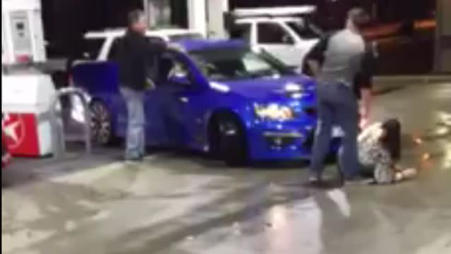 A video uploaded to Facebook shows a man behind the wheel of a Holden ute accelerating after what sounds like a heated argument with some bystanders, pinning a woman to the ground. Photo: Facebook/Lisa Clayton