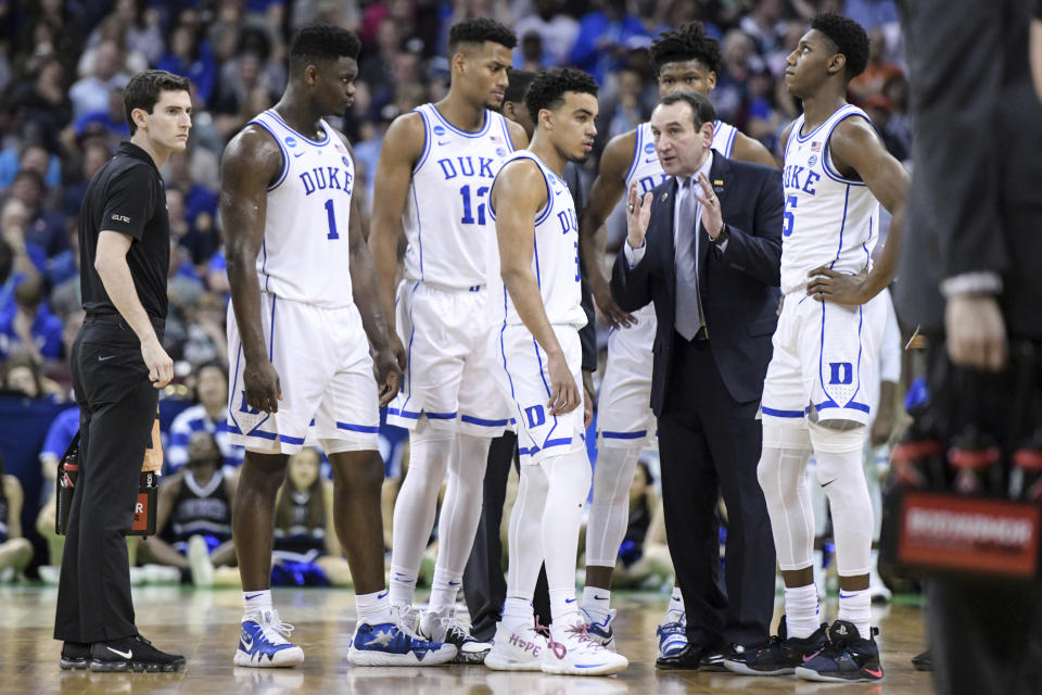 Duke coach Mike Krzyzewski talks with players during a timeout during the second half of the team's second-round game against Central Florida in the NCAA men's college basketball tournament Sunday, March 24, 2019, in Columbia, S.C. Duke won 77-76. (AP Photo/Sean Rayford)