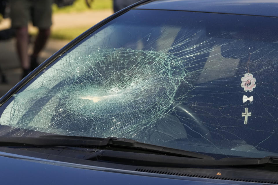 A car with its windscreen smashed, is parked outside the Christ the Good Shepherd Church in suburban Wakely in western Sydney, Australia, Tuesday, April 16, 2024. Australian police say a knife attack in Sydney that wounded a bishop and a priest during a church service as horrified worshippers watched online and in person, and sparked a riot was an act of terrorism. (AP Photo/Mark Baker)