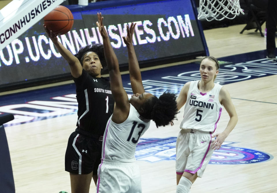 South Carolina guard Zia Cooke (1) shoots against Connecticut guard Christyn Williams (13) in the second half of an NCAA college basketball game in Storrs, Conn., Monday, Feb. 8, 2021. (David Butler/Pool Photo via AP)