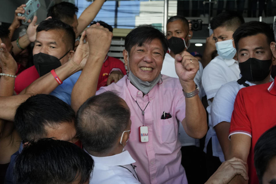 FILE - Presidential candidate Ferdinand "Bongbong" Marcos Jr. celebrates as he greets the crowd outside his headquarters in Mandaluyong, Philippines on Wednesday, May 11, 2022. Allies of the Philippines' presumptive next president, Marcos Jr., appear set to strongly dominate both chambers of Congress, further alarming activists after the late dictator's son scored an apparent election victory that will restore his family to the seat of power. (AP Photo/Aaron Favila, File)