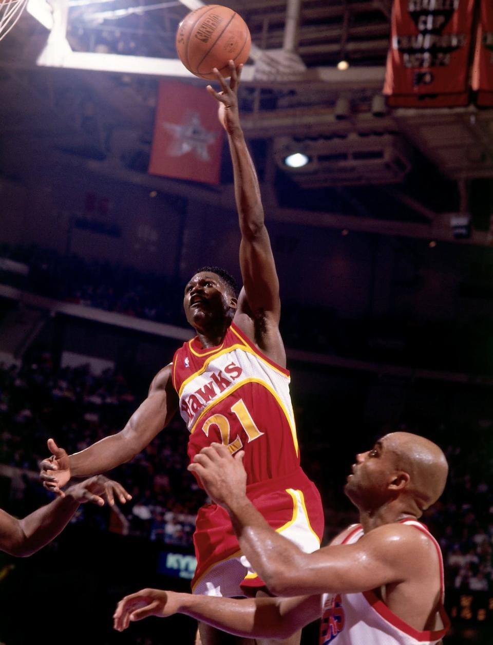 Dominique Wilkins soars over Charles Barkley and the Sixers. (Nathaniel S. Butler/NBAE via Getty Images)