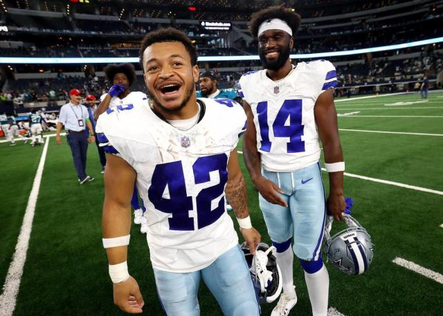 Dallas Cowboys running back Rico Dowdle (23) fumbles the ball against  Jacksonville Jaguars cornerback Gregory Junior (34) during the first half  of an NFL preseason football game, Saturday, Aug. 12, 2023, in