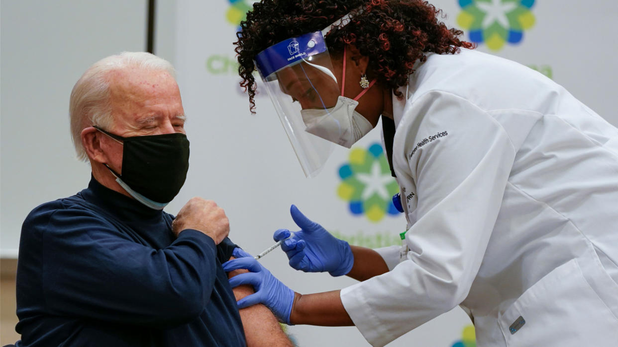 US President-elect Joe Biden receives a Covid-19 vaccination from Tabe Masa, Nurse Practitioner and Head of Employee Health Services, at the Christiana Care campus in Newark, Delaware on December 21, 2020. (Alex Edelman/AFP via Getty Images)