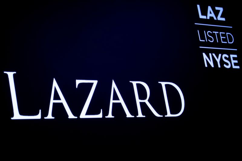 The logo and trading information for Lazard Ltd appear on a screen on the floor at theNYSE in New York