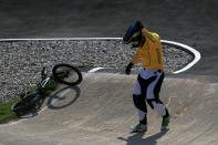 LONDON, ENGLAND - AUGUST 09: Khalen Young of Australia holds his head after crashing during the Men's BMX Cycling Quarter Finals on Day 13 of the London 2012 Olympic Games at BMX Track on August 9, 2012 in London, England. (Photo by Phil Walter/Getty Images)