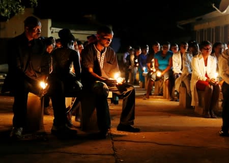 Zimbabwean healthcare workers hold a candlelight vigil to protest over the disappearance of Peter Magombeyi, the leader of their union in Harare