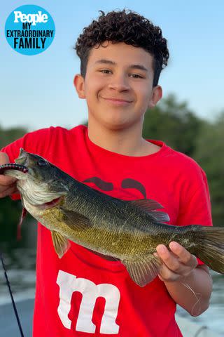 <p>courtesy of the VandeHei family</p> A young Kelvin going fishing with the family