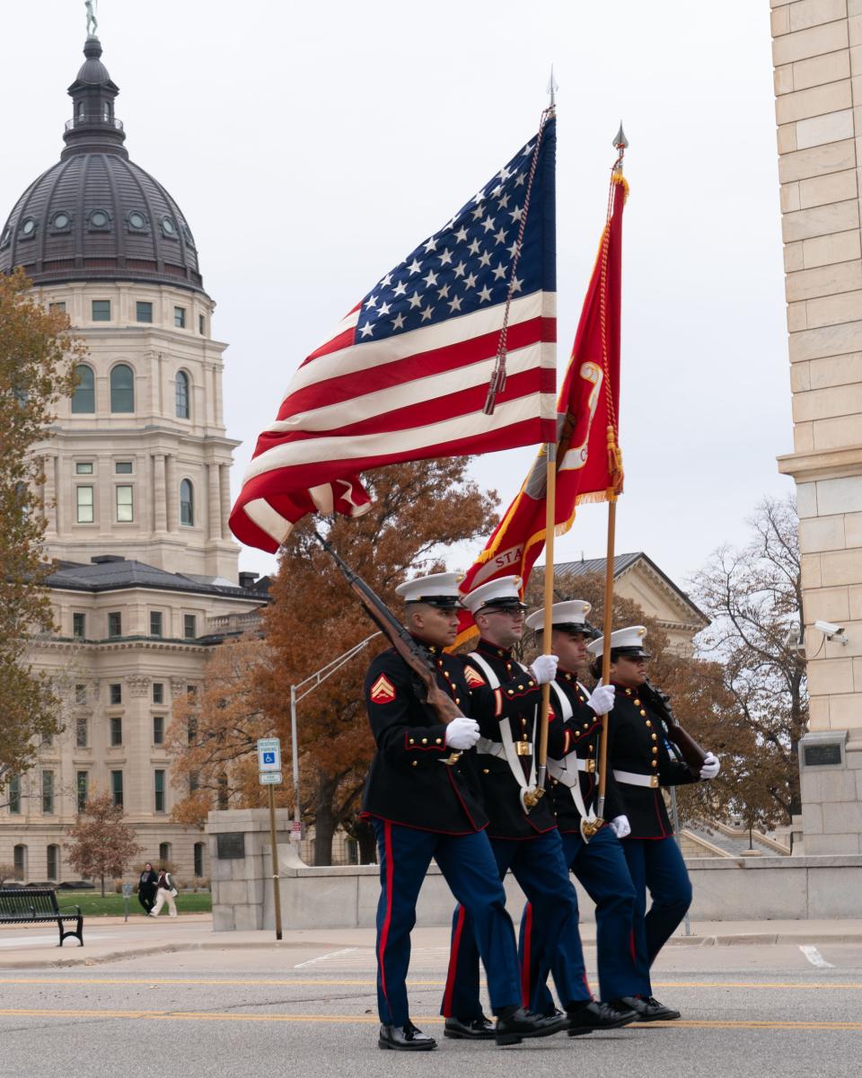 A Marine color guard carries the colors at the start of the Topeka Veterans Day Parade in November. Kansas lawmakers passed several laws this year to benefit military veterans.