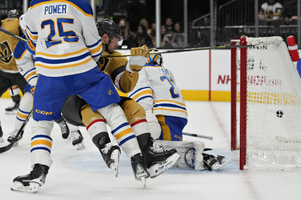 Vegas Golden Knights center Ivan Barbashev (49) scores against the Buffalo Sabres during the second period of an NHL hockey game Friday, Dec. 15, 2023, in Las Vegas. (AP Photo/John Locher)