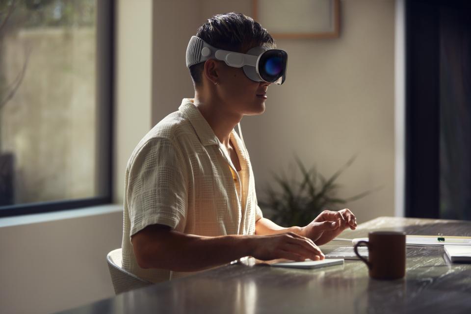 A picture of a person wearing Apple's Vision Pro headset