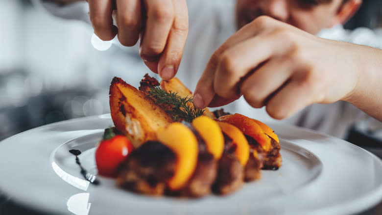 Chef plating food