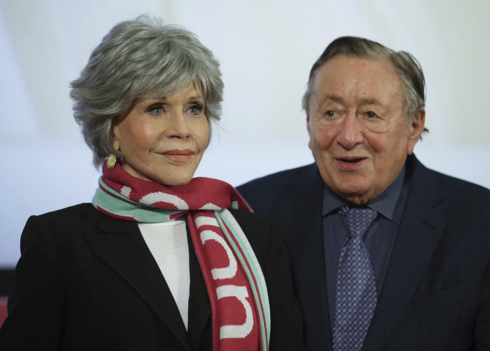 Actress Jane Fonda, left, and her host, businessman Richard Lugner, right, arrive for a news conference on the Vienna Opera Ball in Vienna, Austria, Wednesday, Feb. 15, 2023. (AP Photo/Heinz-Peter Bader)