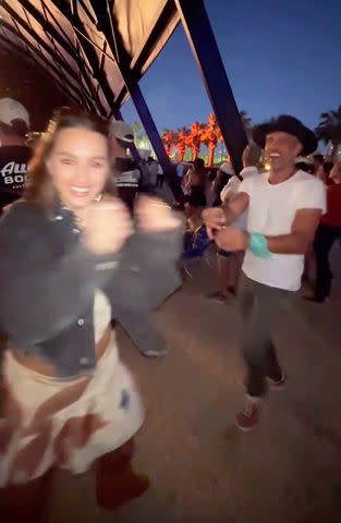 <p>Alexia Umansky/Instagram</p> Alexia and Mauricio dance at Stagecoach music festival