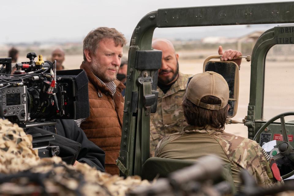 Director Guy Ritchie, left, and actor Dar Salim on the set of 