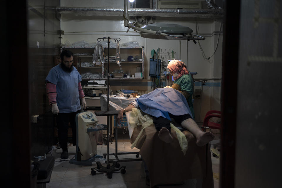 In this Thursday, March 12, 2020 photo, a patient is prepared for surgery at Idlib central hospital in Idlib, Syria. Idlib city is the last urban area still under opposition control in Syria, located in a shrinking rebel enclave in the northwestern province of the same name. Syria’s civil war, which entered its 10th year Monday, March 15, 2020, has shrunk in geographical scope -- focusing on this corner of the country -- but the misery wreaked by the conflict has not diminished. (AP Photo/Felipe Dana)