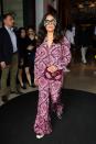 <p>Salma Hayek, whose husband is also Kering’s CEO, François-Henri Pinault— is on her way to the Kering Women in Motion lunch sporting a Gucci pajama set lined with pearls, paired with a furry magenta Gucci bag slung across her body and cheeky, oversized sunglasses to match. (Photo: Getty) </p>