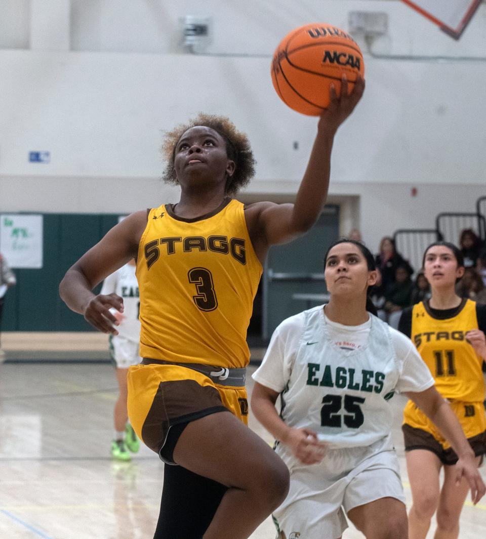 Stagg's Jameelah Pharms, left, goes to the hoop past McNair's Kai Laufiso during a SJAA girls varsity basketball game at McNair in Stockton on Feb 1. 2024.