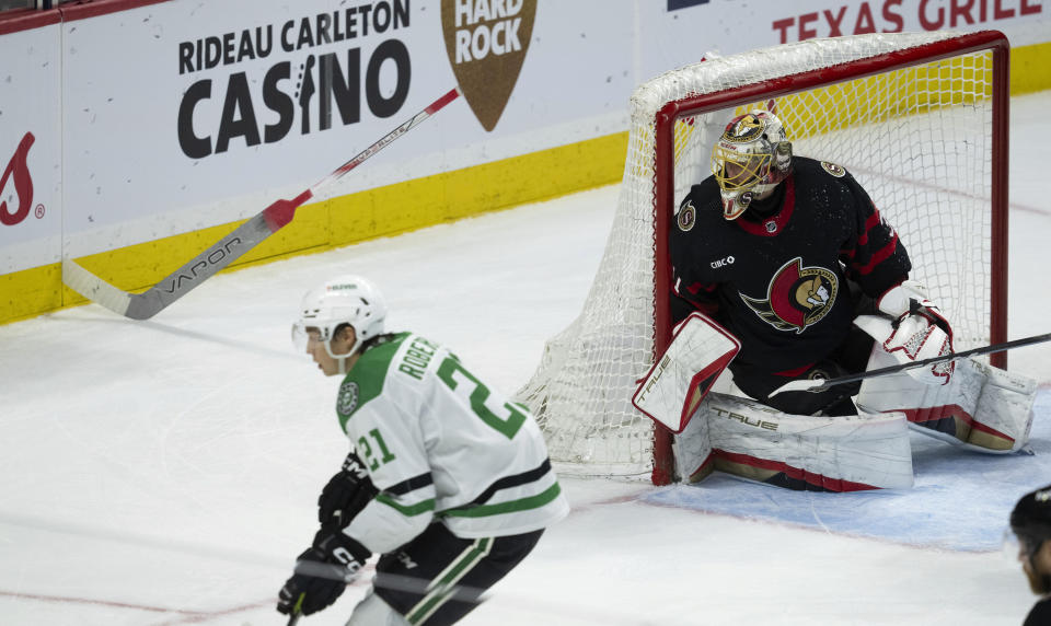 Ottawa Senators goaltender Anton Forsberg watches the play in the corner as his stick rests stuck in the boards during the second period of an NHL hockey game, Thursday, Feb. 22, 2024 in Ottawa, Ontario. (Adrian Wyld/The Canadian Press via AP)