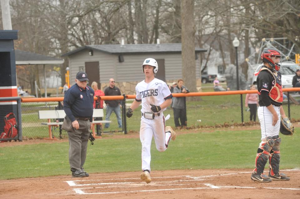 Galion's Braxton Prosser scores off an RBI.