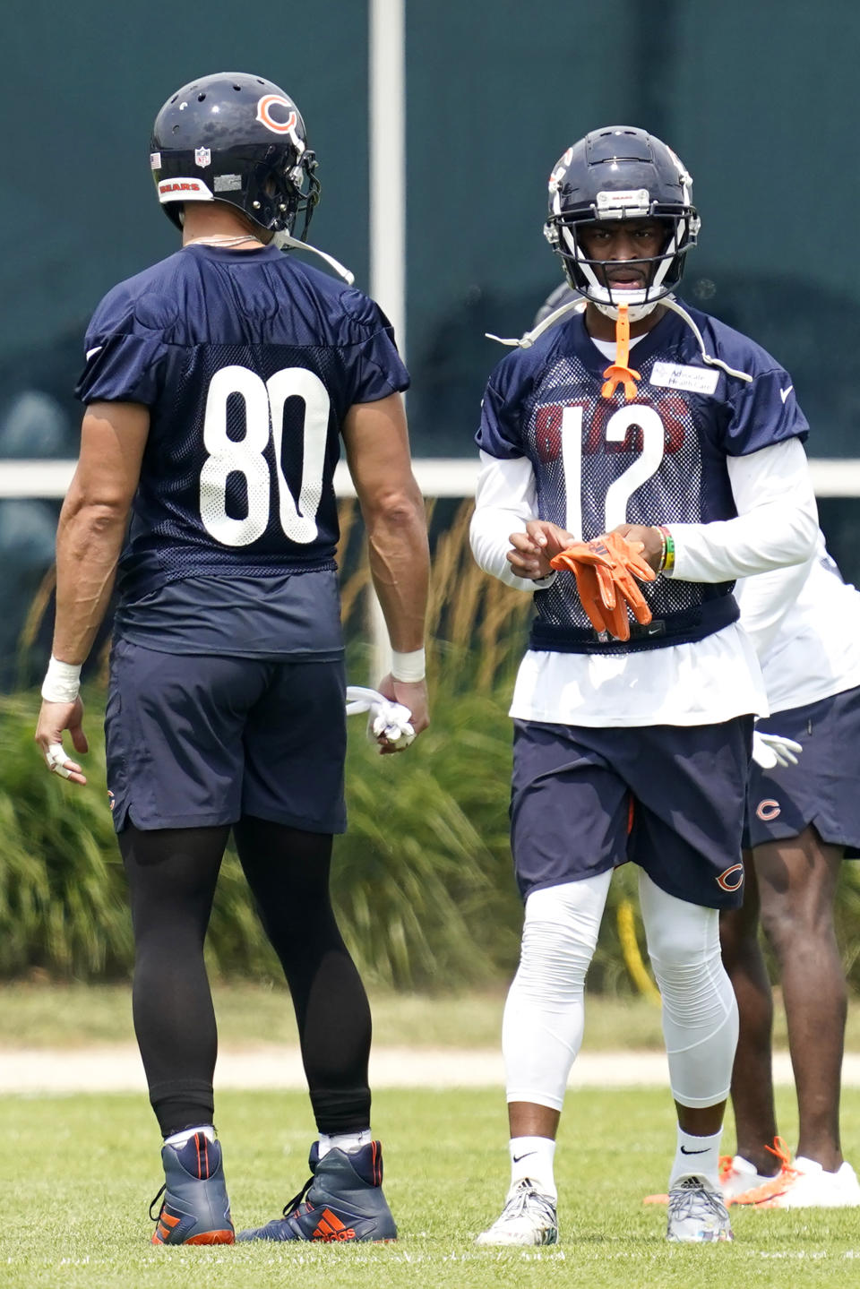 Chicago Bears wide receiver Allen Robinson II, right, talks with tight end Jimmy Graham during NFL football practice in Lake Forest, Ill., Wednesday, July 28, 2021. (AP Photo/Nam Y. Huh)
