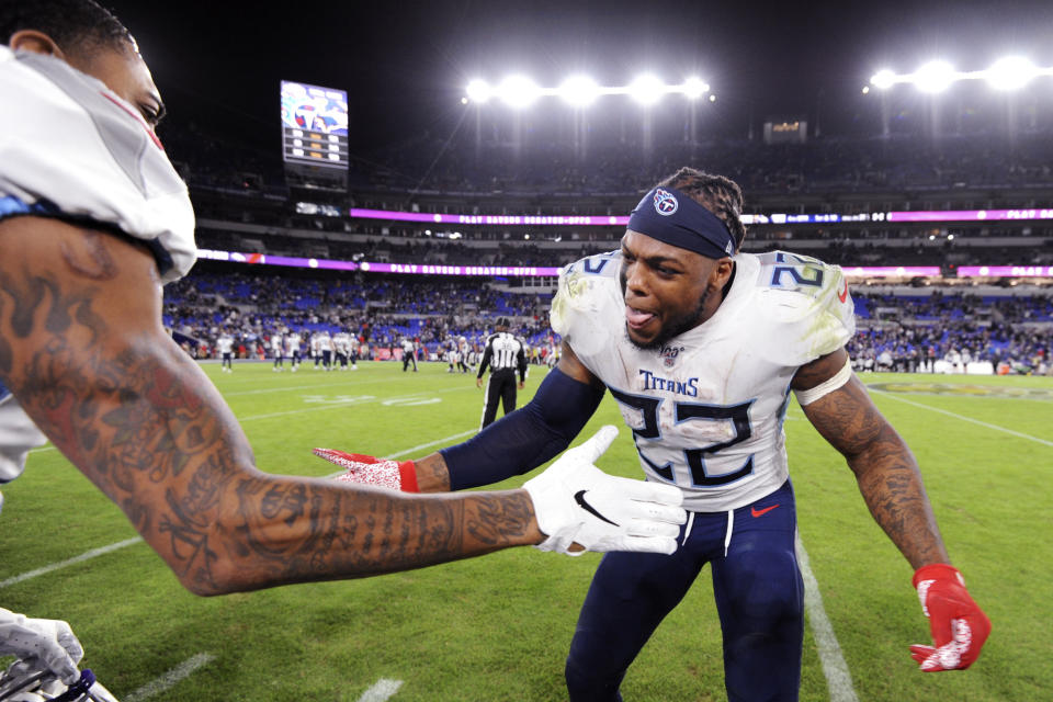 Tennessee Titans running back Derrick Henry (22) celebrates during the second half of an NFL divisional playoff football game against the Baltimore Ravens, Saturday, Jan. 11, 2020, in Baltimore. The Titans won 28-12. (AP Photo/Gail Burton)