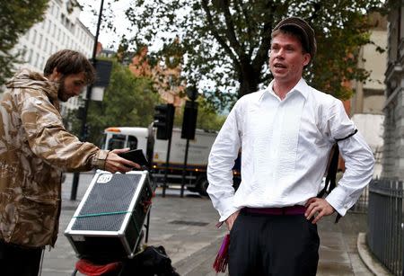 Lauri Love speaks to members of the media as he arrives for his extradition hearing at Westminster Magistrates' Court in London, Britain September 16, 2016. REUTERS/Peter Nicholls