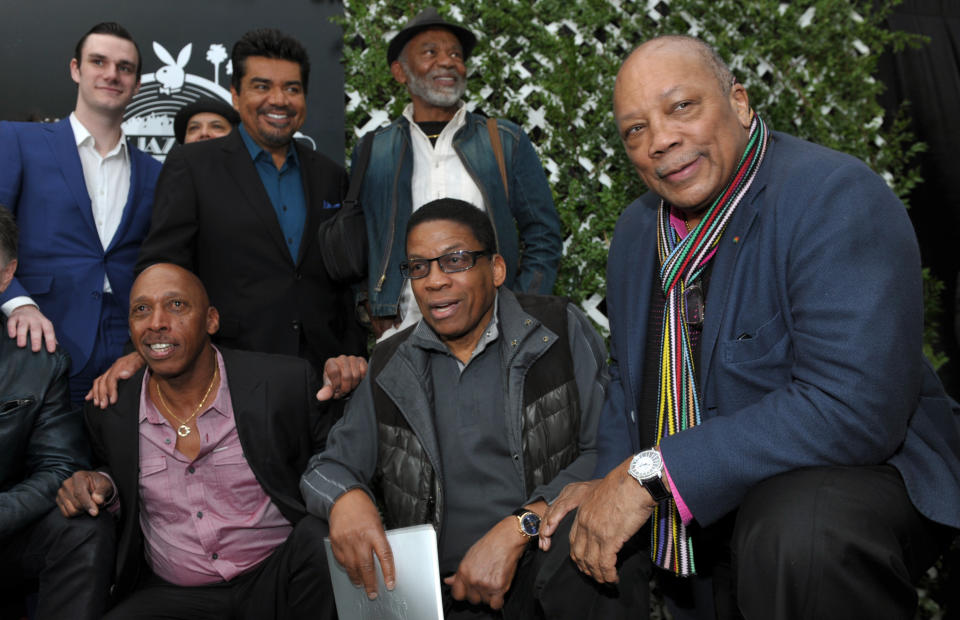 Quincy Jones, right, poses with participants in this year's Playboy Jazz Festival following a news conference at the Playboy Mansion on Thursday, Feb. 28, 2013 in Los Angeles. Clockwise from top left are Playboy Enterprises founder Hugh Hefner's son Cooper, master of ceremonies George Lopez, and musicians Hubert Laws, Herbie Hancock and Jeffrey Osborne. The 35th Anniversary Playboy Jazz Festival will be held at the Hollywood Bowl on June 15 and 16. (Photo by Chris Pizzello/Invision/AP)