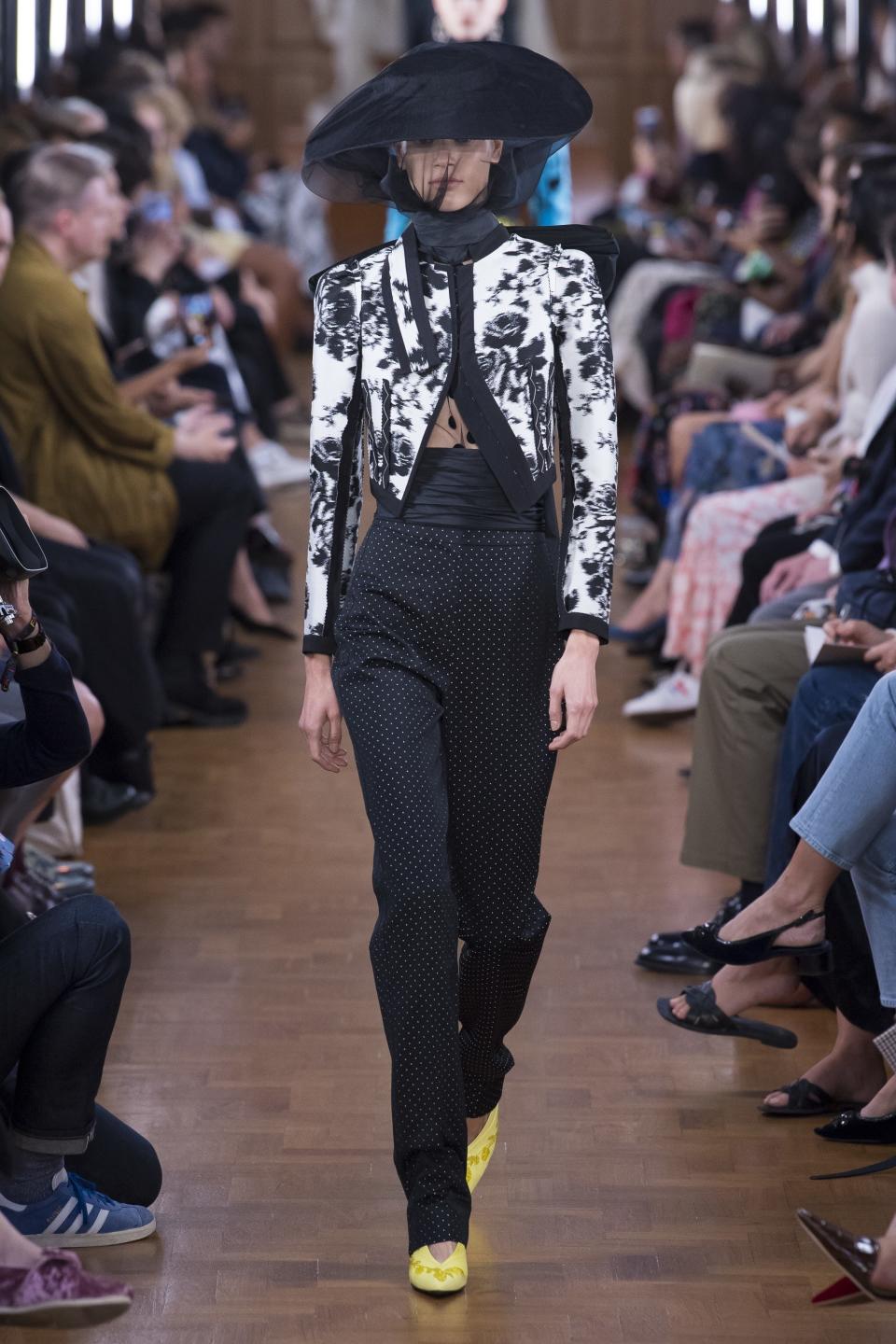 Erdem’s Spring 2019 cropped floral suit jacket and high-waisted pants offers a peek of skin.