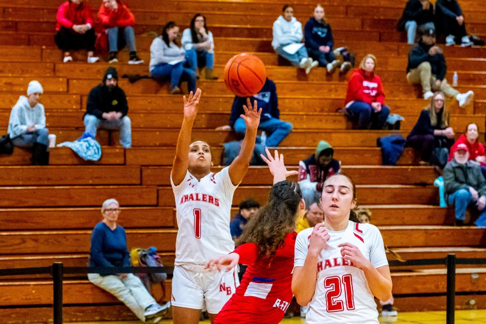 New Bedford's Vanessa Bucha burries the three pointer.