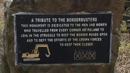 A plaque in front of the 'border buster' JCB digger is seen on the border near Kinawley in Northern Ireland and Swanlinbar in Ireland, in this still image taken from video on February 6, 2019. REUTERS/Reuters TV