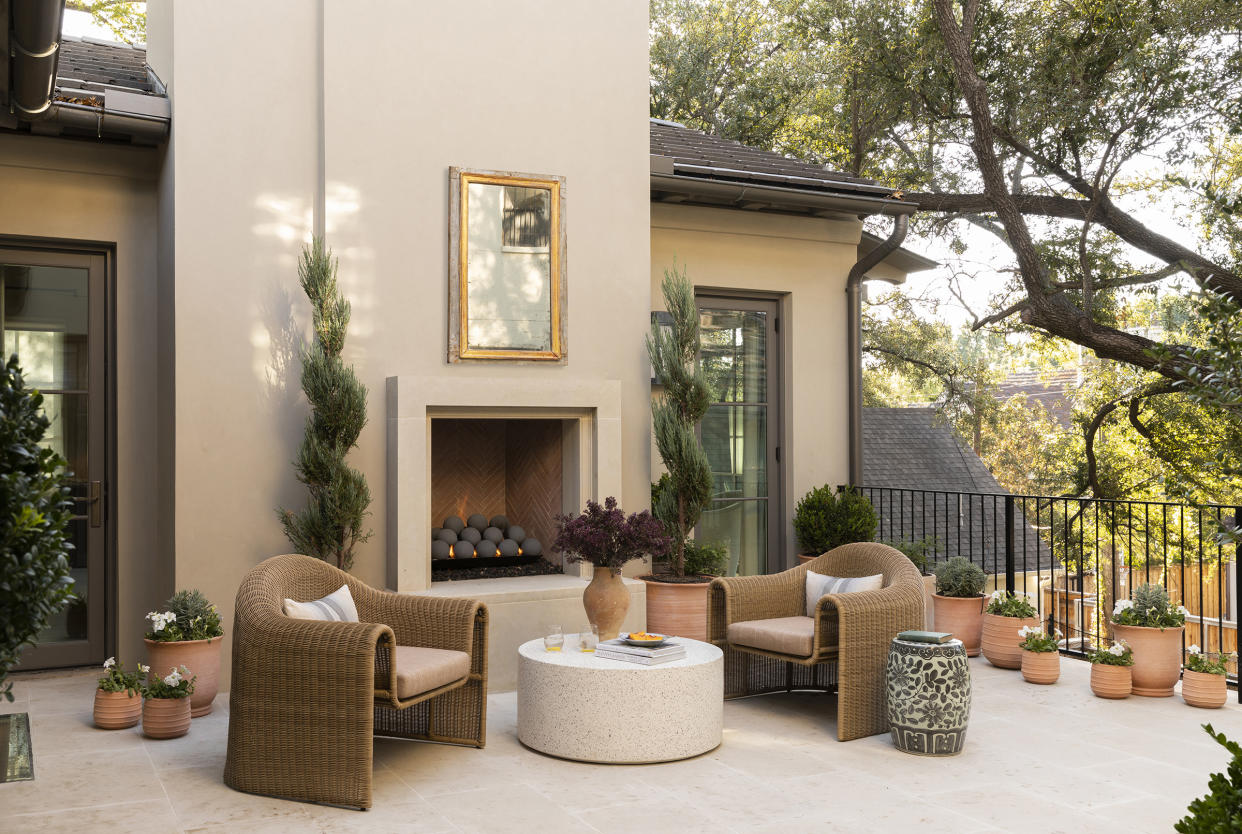  Terrace patio with terracotta flower pots and outdoor living room by Ryan Street. 