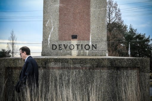 Roy Speckhardt, executive director of the American Humanist Association, walks next to the World War I memorial cross which his group says honors only Christian veterans