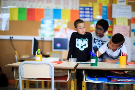 School children work in their classroom at the Primary School Les Ormeaux in Montereau-Fault-Yonne near Paris, France, June 18, 2018. REUTERS/Gonzalo Fuentes/Files