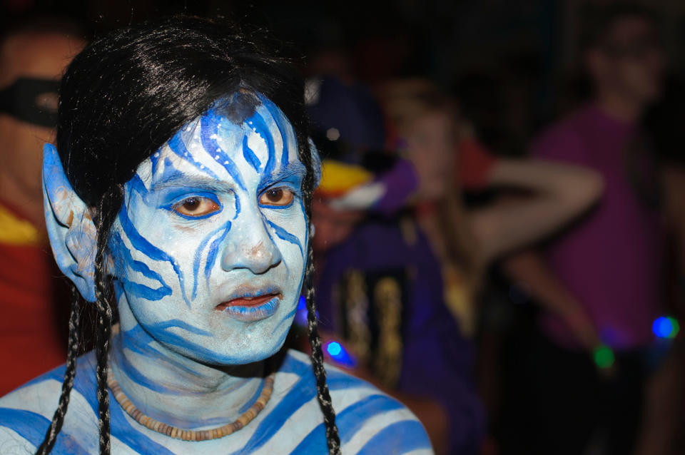 Person with body paint emulating an alien character from the highly successful film 