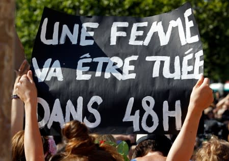 Families of victims and activists attend a rally against "femicide", gender-based violence targeted at women, in Paris