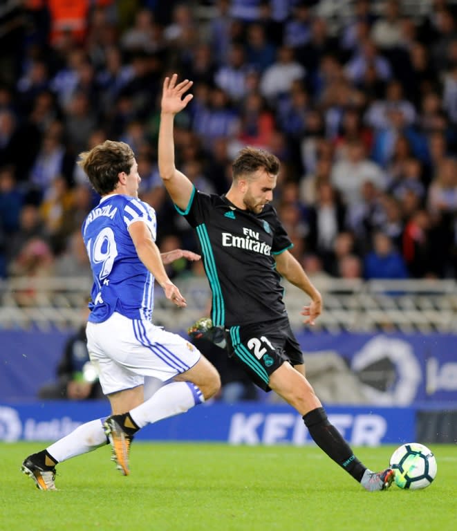 Real Madrid's forward Borja Mayoral (R) clashes with Real Sociedad's defender Alvaro Odriozola on September 17, 2017