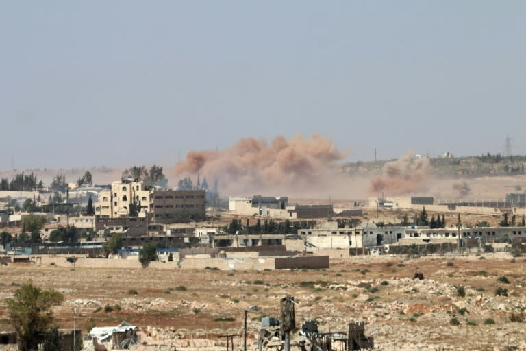 Smoke billows near the road leading to Bani Zeid during an operation by Syrian government forces to retake control of the rebel-held district of Leramun, outskirts of Aleppo, on July 26, 2016