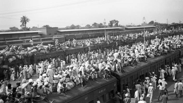 Refugees crowd onto to trains during the partition of British India in 1947