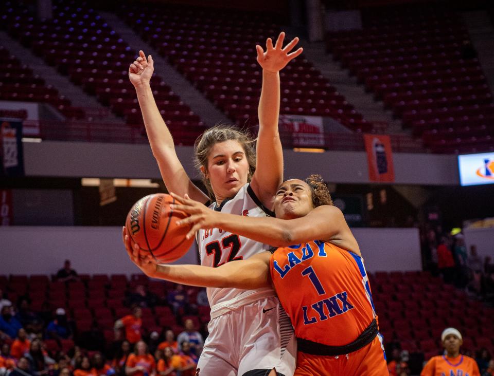 Byron's Ava Kultgen (22) blocks a shot by Chicago Butler's Xamiya Walton (1) during the first quarter of the Class 2A state semifinal game on Thursday, March 2, 2023.