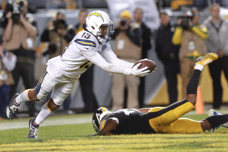 Los Angeles Chargers wide receiver Keenan Allen (13), left catches a deflected pass for a touchdown in the second half of an NFL football game, Sunday, Dec. 2, 2018, in Pittsburgh. Pittsburgh Steelers free safety Sean Davis (21) is at right.(AP Photo/Don Wright)