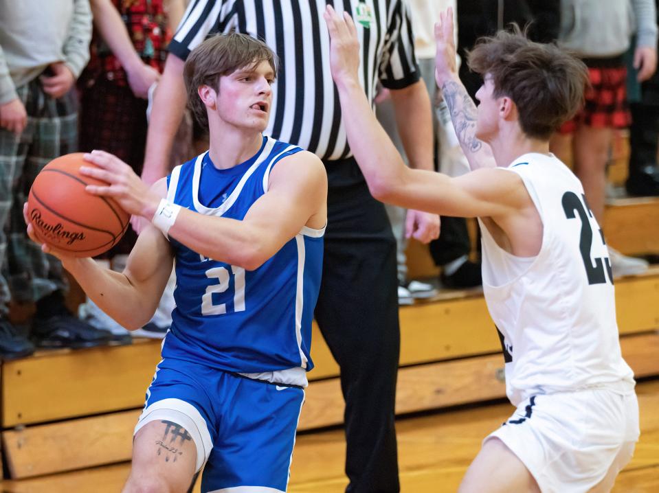 Lake’s Caleb Collins is guarded by Perry’s Luca Miller on Friday, Dec. 2, 2022.